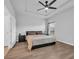 Serene bedroom with a tray ceiling, ceiling fan, and wood-look flooring at 4105 Da Vinci Dr., Myrtle Beach, SC 29579