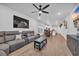 Open-concept living room features modern decor, wood floors, and a ceiling fan at 4105 Da Vinci Dr., Myrtle Beach, SC 29579