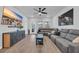 Bright living room boasts a large TV, wood floors, and a contemporary cabinet at 4105 Da Vinci Dr., Myrtle Beach, SC 29579