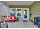 Covered back patio with outdoor seating, a ceiling fan, and a sliding glass door at 4105 Da Vinci Dr., Myrtle Beach, SC 29579