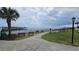 A tranquil view of the community with benches overlooking a body of water and beach at 415 Ocean Creek Dr. # 2443, Myrtle Beach, SC 29572