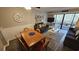 Comfortable living room with dining area and sliding glass doors to the balcony at 415 Ocean Creek Dr. # 2443, Myrtle Beach, SC 29572