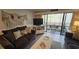 Living and dining area featuring coastal decorations and access to a balcony at 415 Ocean Creek Dr. # 2443, Myrtle Beach, SC 29572