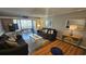 Comfortable living room with dining area, and sliding glass doors to the balcony at 415 Ocean Creek Dr. # 2443, Myrtle Beach, SC 29572