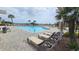 Relaxing poolside with lounge chairs and palm trees, creating a perfect vacation spot at 415 Ocean Creek Dr. # 2443, Myrtle Beach, SC 29572