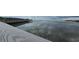 Scenic view of the water and beach from the bridge, with cloudy skies adding depth at 415 Ocean Creek Dr. # 2443, Myrtle Beach, SC 29572