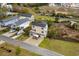 Aerial view of a home showcasing its landscaped yard and spacious driveway at 4387 Landing Rd., Little River, SC 29566