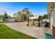 Relaxing outdoor area featuring a paved area with seating beneath a sunshade at 4387 Landing Rd., Little River, SC 29566