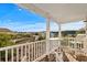 Inviting covered balcony featuring string lights, outdoor seating and stunning views of the neighborhood at 4387 Landing Rd., Little River, SC 29566