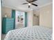 Bright bedroom featuring a ceiling fan, large window, and a chest of drawers at 4387 Landing Rd., Little River, SC 29566