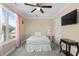 Bright bedroom with a comfortable bed, ceiling fan, flat screen tv and ample natural light at 4387 Landing Rd., Little River, SC 29566