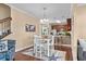 Charming dining area with seating for four, seamlessly connected to the modern kitchen and living spaces at 4387 Landing Rd., Little River, SC 29566
