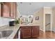 Kitchen island with granite countertop and sink, complemented by pendant lighting at 4387 Landing Rd., Little River, SC 29566