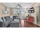 Cozy living room features a comfortable sectional sofa, hardwood floors, and access to a balcony at 4387 Landing Rd., Little River, SC 29566