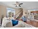 Inviting living space with hardwood floors, cozy seating, and an open layout leading to the kitchen at 4387 Landing Rd., Little River, SC 29566