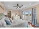 Bedroom featuring a balcony, ceiling fan, and coastal decorations at 4387 Landing Rd., Little River, SC 29566