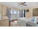 Bedroom boasting a balcony, ceiling fan, and a cozy, inviting atmosphere at 4387 Landing Rd., Little River, SC 29566