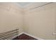 Empty walk-in closet with wire shelving and dark wood flooring at 4387 Landing Rd., Little River, SC 29566