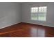 Bright bedroom features a large window and hardwood flooring at 4664 Southgate Pkwy., Myrtle Beach, SC 29579