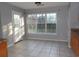 Bright dining area with large windows overlooking the backyard and tiled floors at 4664 Southgate Pkwy., Myrtle Beach, SC 29579