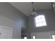 High-ceiling foyer with elegant lighting fixture and large window above front door at 4664 Southgate Pkwy., Myrtle Beach, SC 29579