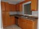 Well-lit kitchen with modern sink, stainless steel dishwasher, and ample countertop space at 4664 Southgate Pkwy., Myrtle Beach, SC 29579