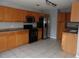 Spacious kitchen featuring stainless steel appliances, tile flooring, and generous cabinet space at 4664 Southgate Pkwy., Myrtle Beach, SC 29579