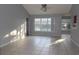 Spacious living area with vaulted ceiling, neutral paint, and large windows at 4664 Southgate Pkwy., Myrtle Beach, SC 29579
