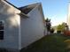 The side exterior shows vinyl siding, dark roof, green yard, and proximity to the neighboring house at 4664 Southgate Pkwy., Myrtle Beach, SC 29579