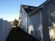 The side exterior displays vinyl siding, a dark roof, and an AC unit next to the home at 4664 Southgate Pkwy., Myrtle Beach, SC 29579