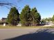 Street view with green trees, shrubs, and well-kept lawns alongside the road at 4664 Southgate Pkwy., Myrtle Beach, SC 29579