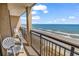Balcony overlooking the beach and ocean with seating at 4800 S Ocean Blvd. # 1103, North Myrtle Beach, SC 29582