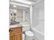 Bathroom with a granite-topped vanity, white toilet and tub with tile surround at 4800 S Ocean Blvd. # 1103, North Myrtle Beach, SC 29582