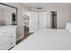 Cozy bedroom featuring neutral walls and white trim, offering a serene retreat with glimpses into adjacent rooms at 4800 S Ocean Blvd. # 1103, North Myrtle Beach, SC 29582