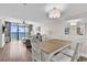 Bright and comfortable dining area with hardwood floors, an ocean view, and stylish furniture at 4800 S Ocean Blvd. # 1103, North Myrtle Beach, SC 29582
