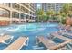 Relaxing pool area featuring a spacious sundeck with lounge chairs, perfect for unwinding at 4800 S Ocean Blvd. # 1103, North Myrtle Beach, SC 29582