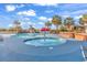 A fun splash pool featuring a mushroom fountain, surrounded by chairs and palm trees at 4800 S Ocean Blvd. # 1103, North Myrtle Beach, SC 29582