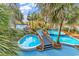 Lush pool area featuring winding waterways, tropical landscaping and a relaxing ambiance at 4800 S Ocean Blvd. # 1103, North Myrtle Beach, SC 29582