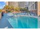 Enjoy a refreshing swim in this sparkling pool with lounge chairs and palm trees at 4800 S Ocean Blvd. # 1103, North Myrtle Beach, SC 29582