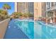 Large pool surrounded by lounge chairs, perfect for soaking up the sun at 4800 S Ocean Blvd. # 1103, North Myrtle Beach, SC 29582