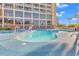 Gorgeous pool with ample seating, ideal for relaxation and socializing at 4800 S Ocean Blvd. # 1103, North Myrtle Beach, SC 29582