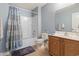 Bathroom with a bathtub-shower combo and a wooden vanity, creating a functional and comfortable space at 5012 Prato Loop # 5012, Myrtle Beach, SC 29579