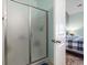 Bathroom featuring a frosted glass shower door leading into a view of the bedroom, creating a private ensuite at 5012 Prato Loop # 5012, Myrtle Beach, SC 29579