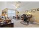 Bonus room featuring a ceiling fan, a sofa, desk area, and natural light from the large window at 5012 Prato Loop # 5012, Myrtle Beach, SC 29579