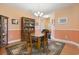 Traditional dining room with wood table, seating for four, and china cabinet at 5012 Prato Loop # 5012, Myrtle Beach, SC 29579