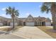 Attractive townhome featuring a wide driveway and attached garages at 5012 Prato Loop # 5012, Myrtle Beach, SC 29579