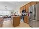 Spacious kitchen with stainless steel appliances, island, and an adjacent living area at 5012 Prato Loop # 5012, Myrtle Beach, SC 29579