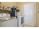 Laundry room equipped with a modern washer and dryer, along with shelving for organized storage at 5012 Prato Loop # 5012, Myrtle Beach, SC 29579