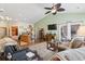 Open-concept living room with vaulted ceilings, ceiling fan, hardwood floors, and access to a screened-in porch at 5012 Prato Loop # 5012, Myrtle Beach, SC 29579