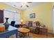 Comfortable living room with yellow walls, ceiling fan, and hardwood floors at 5012 Prato Loop # 5012, Myrtle Beach, SC 29579